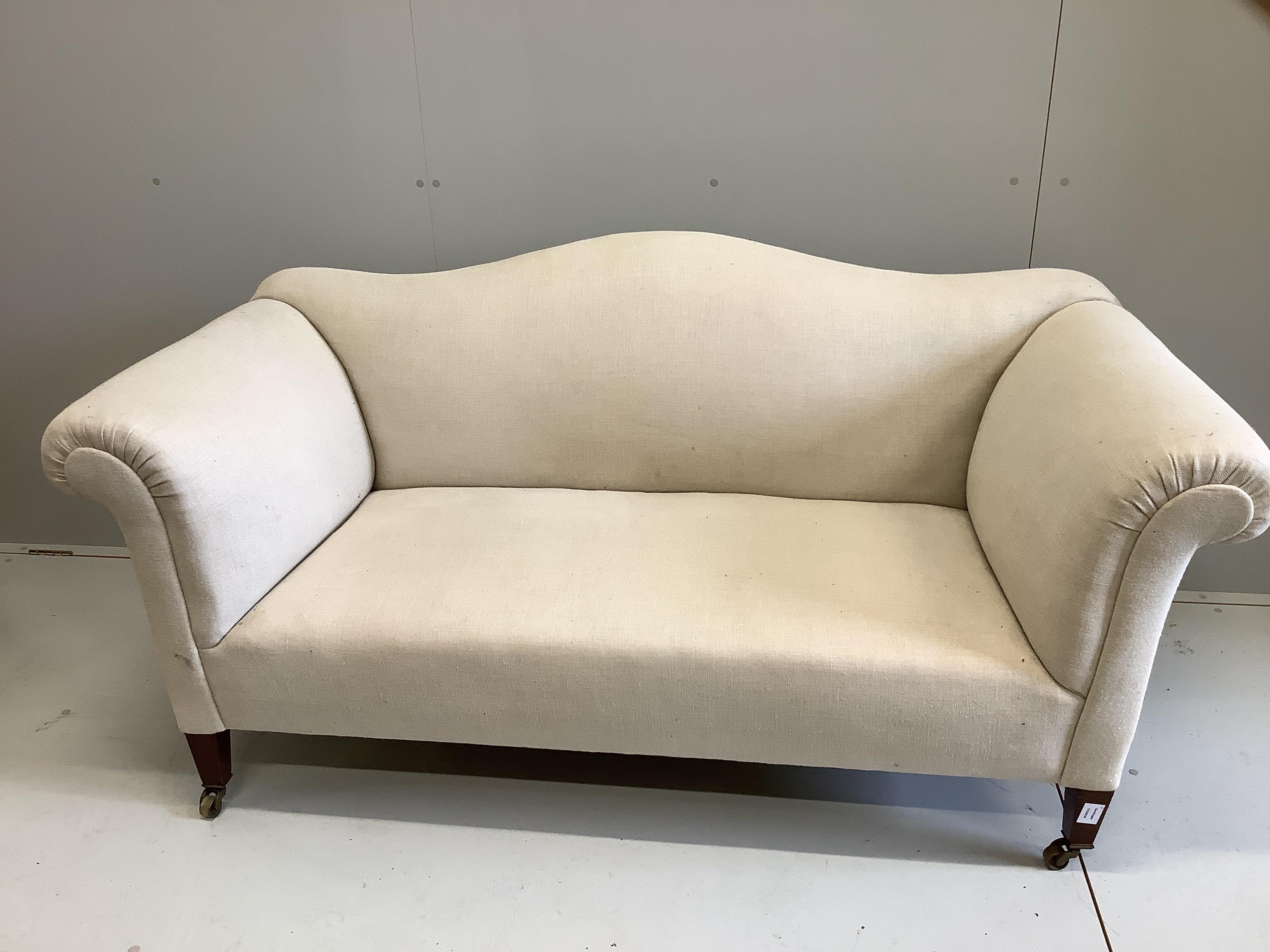 An Edwardian scroll arm settee, recently re-upholstered in a natural colour fabric, width 170cm, depth 80cm, height 72cm